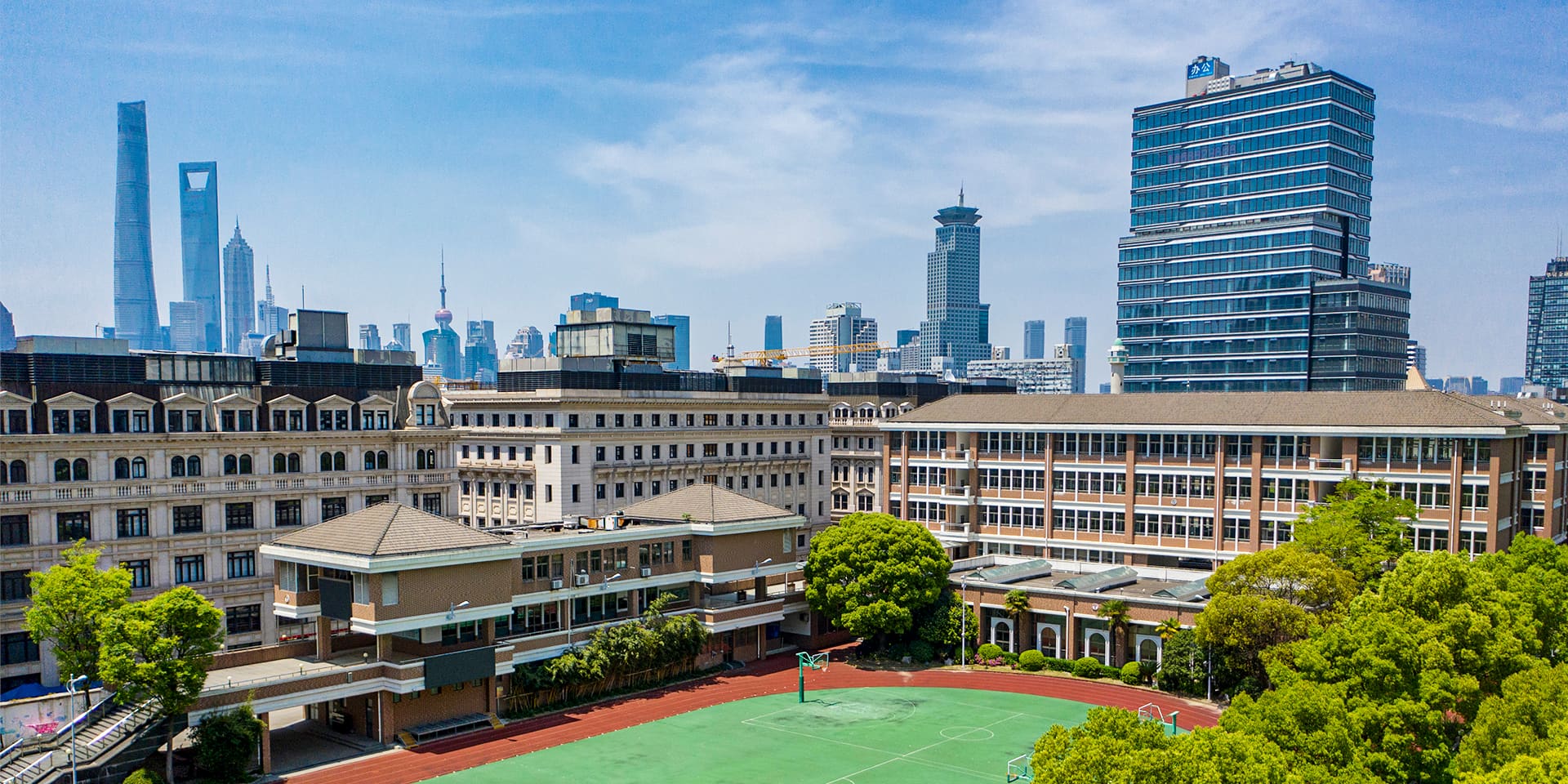 Jianping West Middle School campus and Shanghai skyline